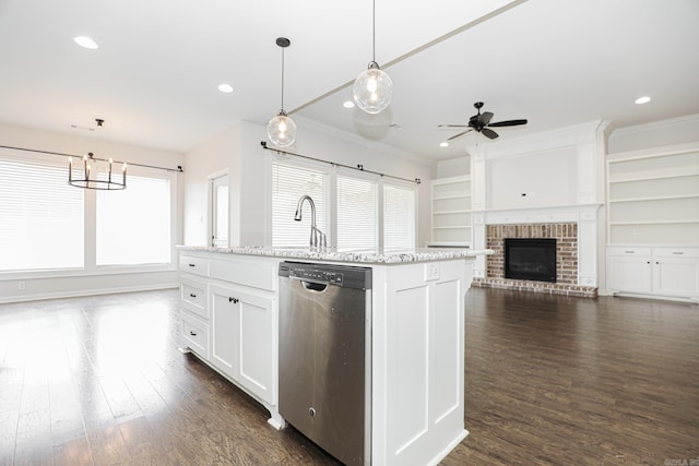 kitchen featuring white cabinetry, dark hardwood / wood-style flooring, hanging light fixtures, an island with sink, and stainless steel dishwasher