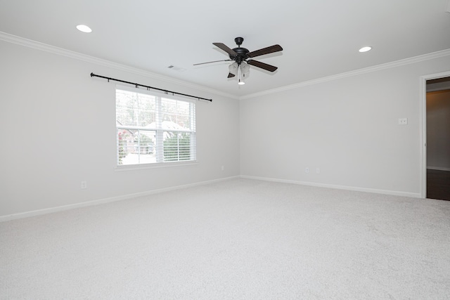 carpeted empty room with ceiling fan and ornamental molding