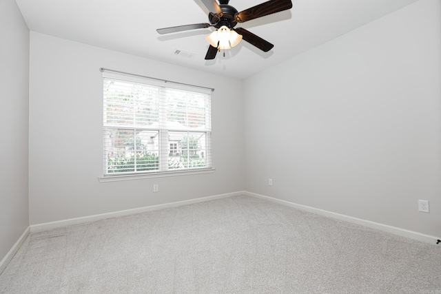 carpeted empty room with ceiling fan