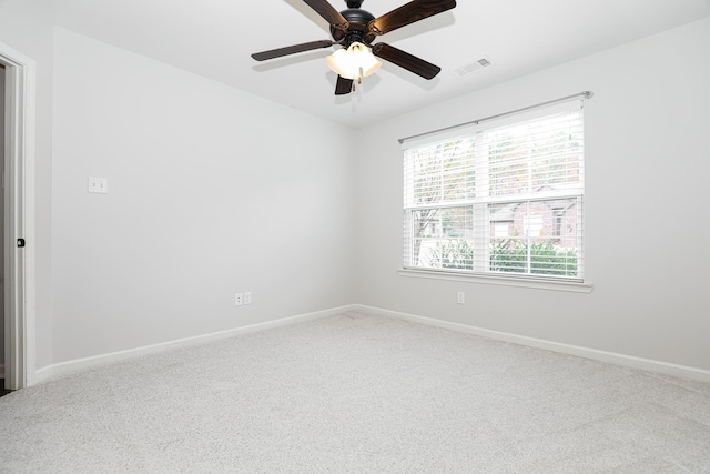 empty room featuring carpet flooring and ceiling fan