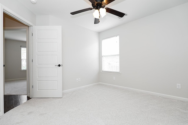 unfurnished room with carpet floors and ceiling fan