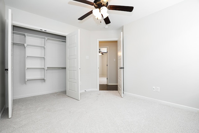 unfurnished bedroom with light carpet, ceiling fan, and a closet