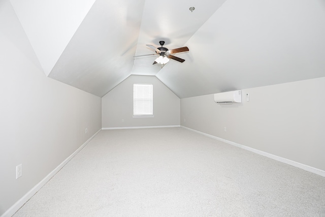 bonus room with ceiling fan, carpet flooring, an AC wall unit, and vaulted ceiling