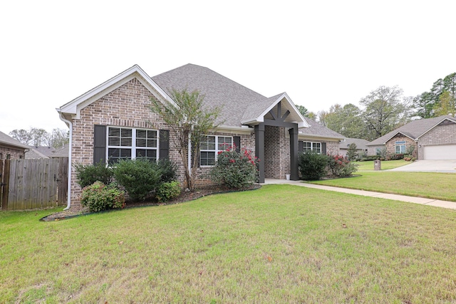 view of front of property featuring a garage and a front yard