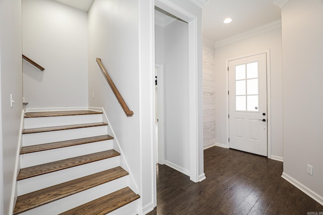 entryway with dark wood-type flooring and crown molding