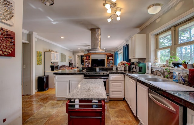 kitchen with ornamental molding, kitchen peninsula, stainless steel appliances, and white cabinetry