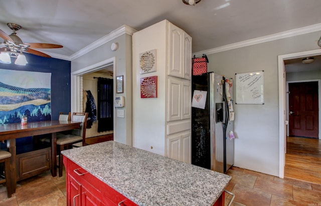 kitchen with stainless steel fridge, crown molding, light wood-type flooring, ceiling fan, and a center island