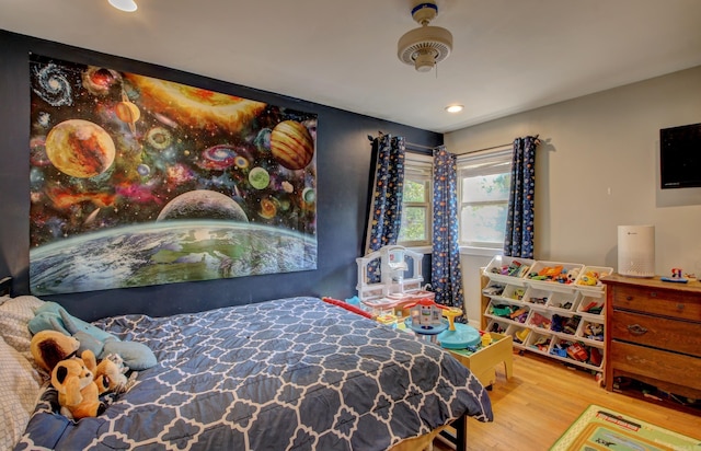 bedroom with hardwood / wood-style floors