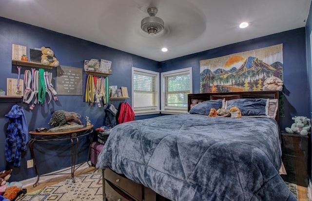 bedroom featuring ceiling fan and light hardwood / wood-style flooring