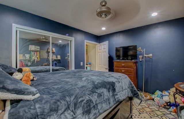 bedroom with ceiling fan and a closet