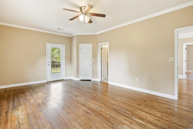 spare room featuring hardwood / wood-style flooring, ceiling fan, and ornamental molding