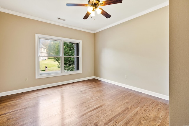 unfurnished room with ornamental molding, ceiling fan, and light hardwood / wood-style flooring