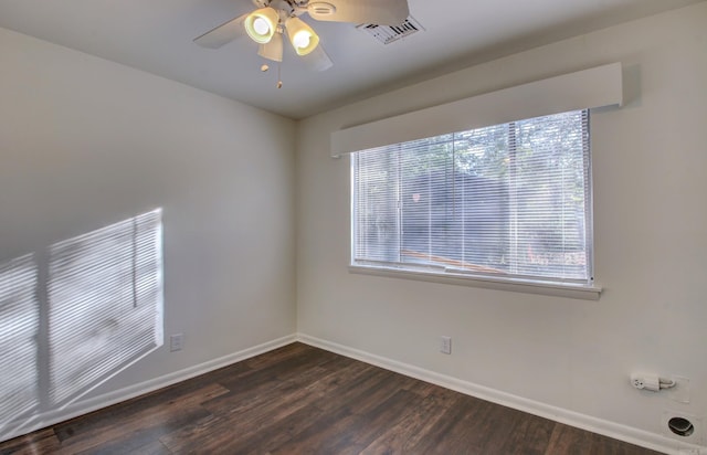 empty room with dark wood-type flooring and ceiling fan