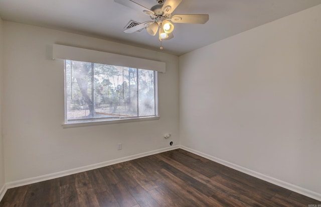 unfurnished room with dark hardwood / wood-style flooring and ceiling fan