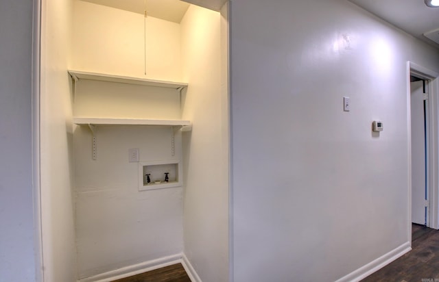 washroom featuring dark hardwood / wood-style flooring and hookup for a washing machine