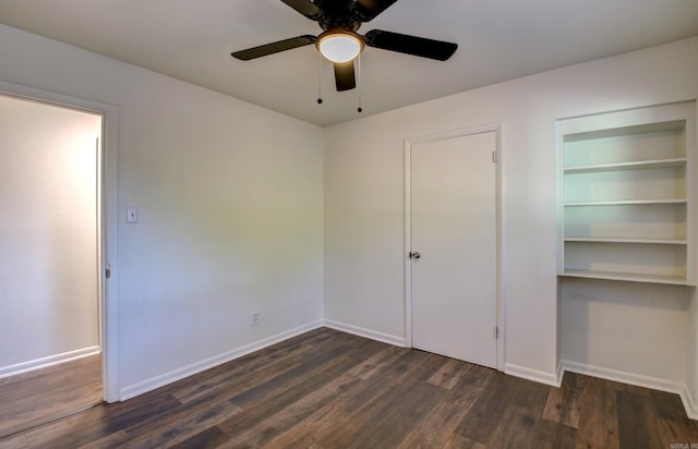 unfurnished bedroom with dark hardwood / wood-style flooring and ceiling fan