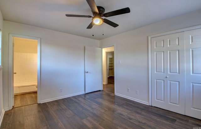 unfurnished bedroom with dark wood-type flooring, ceiling fan, connected bathroom, and a closet