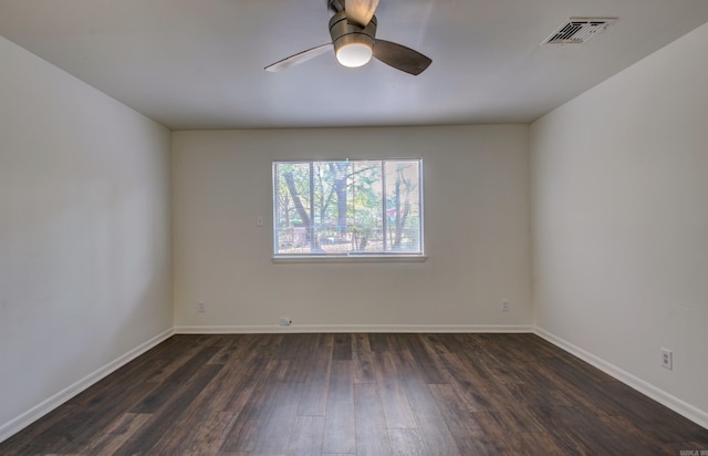 unfurnished room with ceiling fan and dark hardwood / wood-style floors