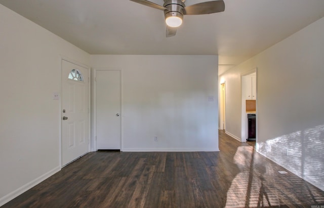 unfurnished room with dark hardwood / wood-style floors and ceiling fan