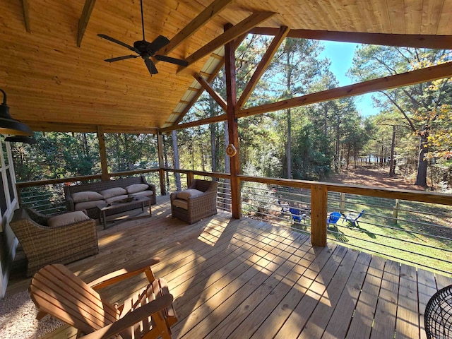 deck featuring an outdoor living space and ceiling fan