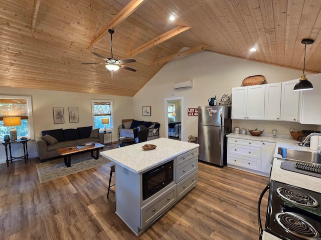 kitchen with wooden ceiling, appliances with stainless steel finishes, decorative light fixtures, dark hardwood / wood-style flooring, and white cabinetry