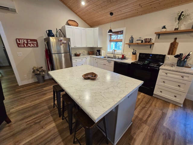 kitchen featuring wooden ceiling, hanging light fixtures, black range with electric cooktop, dark hardwood / wood-style flooring, and stainless steel refrigerator