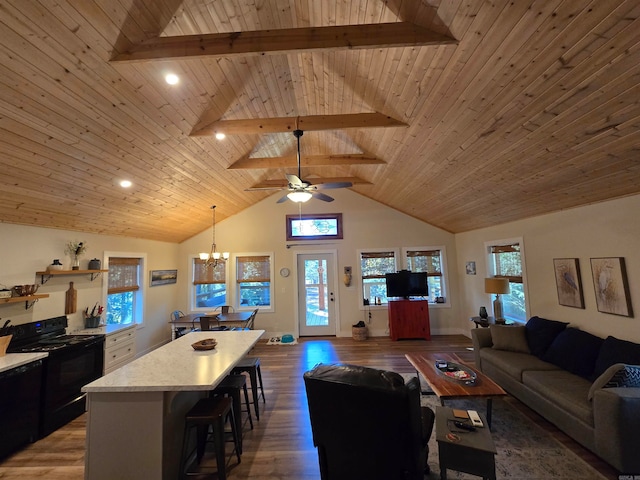 living room featuring beam ceiling, wood ceiling, and hardwood / wood-style flooring