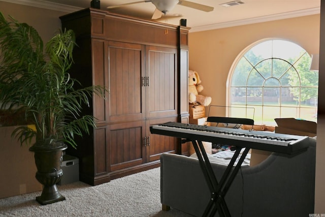 miscellaneous room with carpet, ceiling fan, and crown molding