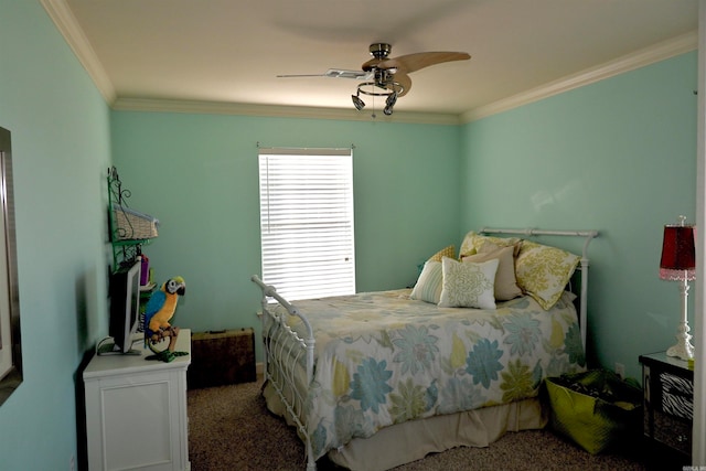 carpeted bedroom with ceiling fan and crown molding