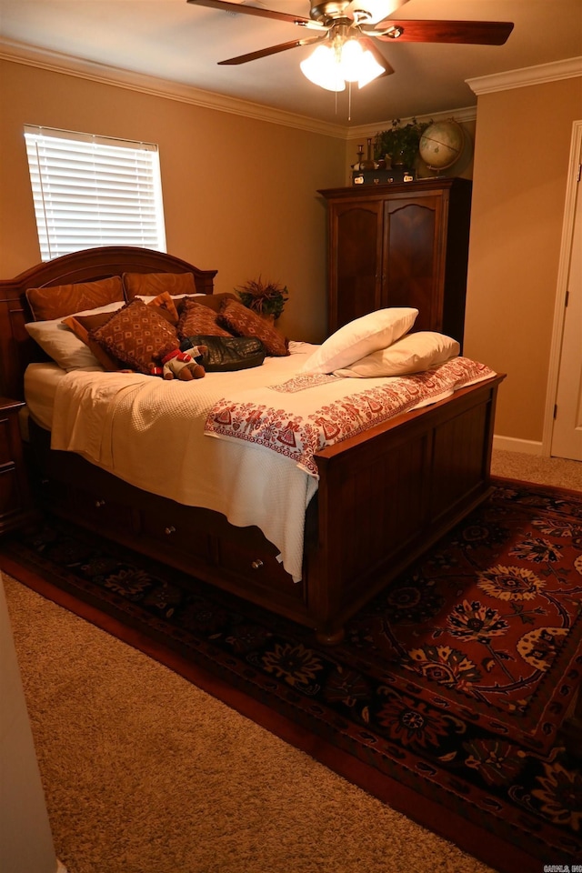 bedroom featuring carpet, ceiling fan, and crown molding