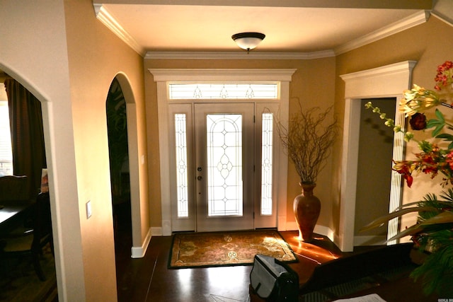 entryway featuring dark hardwood / wood-style flooring and crown molding