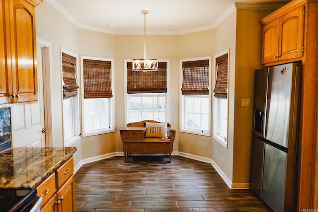 kitchen with stone counters, crown molding, a notable chandelier, dark wood-type flooring, and stainless steel fridge with ice dispenser