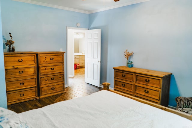 bedroom featuring dark hardwood / wood-style floors and crown molding