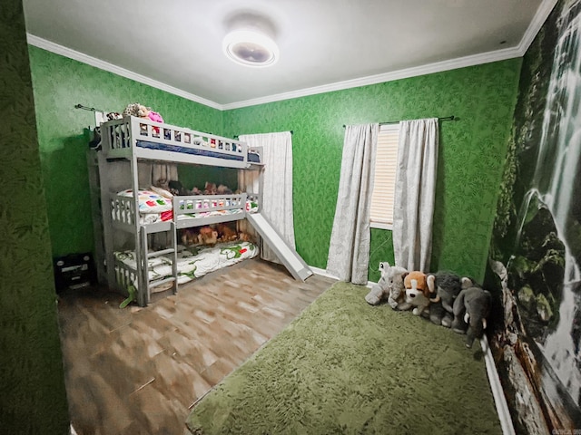 bedroom featuring hardwood / wood-style flooring and ornamental molding