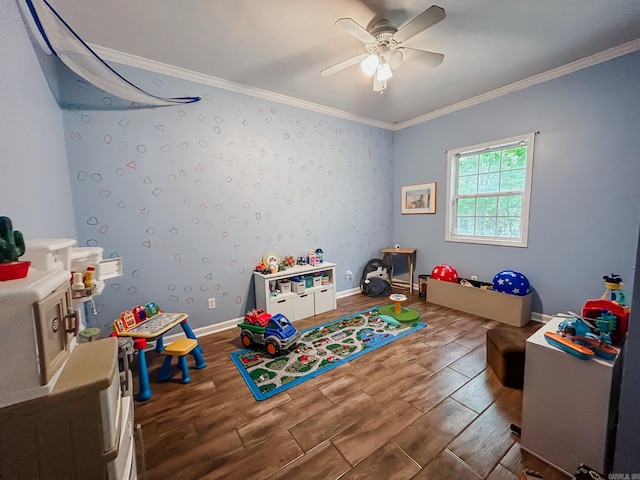 playroom with ceiling fan, wood-type flooring, and crown molding