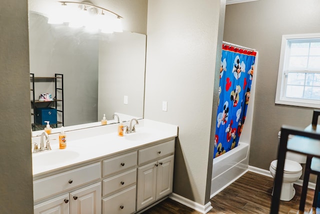 full bathroom with vanity, hardwood / wood-style flooring, toilet, and shower / bathtub combination with curtain