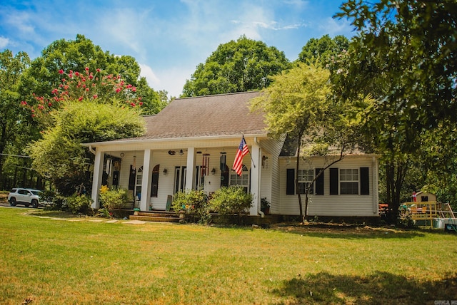 view of front of home with a porch and a front lawn