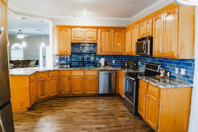 kitchen featuring stainless steel appliances, kitchen peninsula, ceiling fan, dark wood-type flooring, and pendant lighting