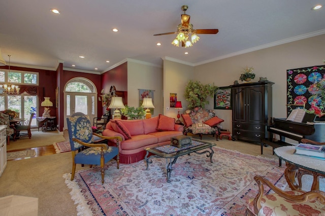 carpeted living room with ornamental molding and ceiling fan with notable chandelier