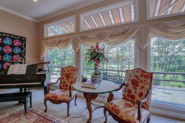 living area featuring a wealth of natural light, light colored carpet, and ornamental molding