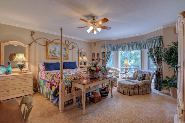 carpeted bedroom with ceiling fan, a textured ceiling, and ornamental molding