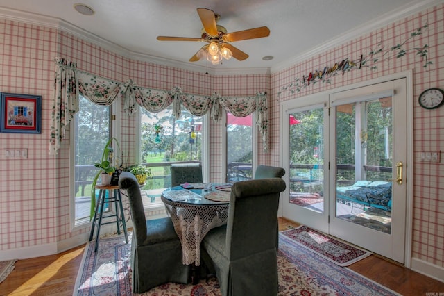 dining space featuring ornamental molding and a healthy amount of sunlight