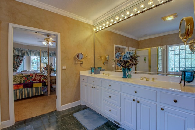 bathroom with a shower with door, ceiling fan, vanity, crown molding, and tile patterned floors