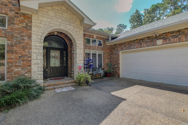 entrance to property featuring a garage