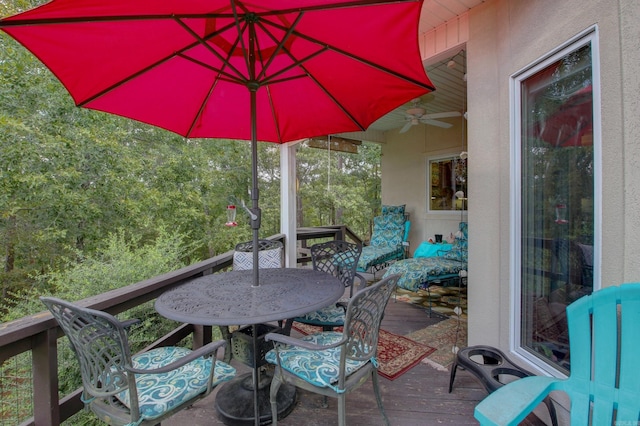 wooden deck featuring ceiling fan