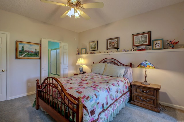 carpeted bedroom with ceiling fan and a textured ceiling