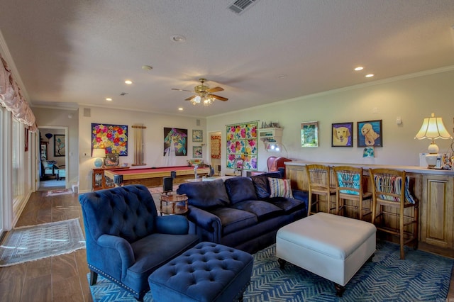 living room featuring pool table, dark hardwood / wood-style floors, crown molding, and ceiling fan