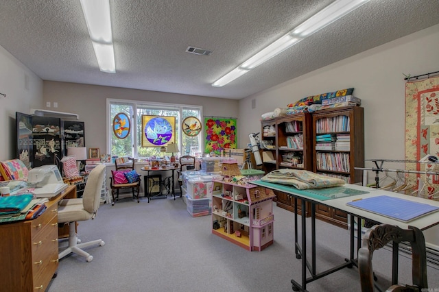 carpeted office space featuring a textured ceiling