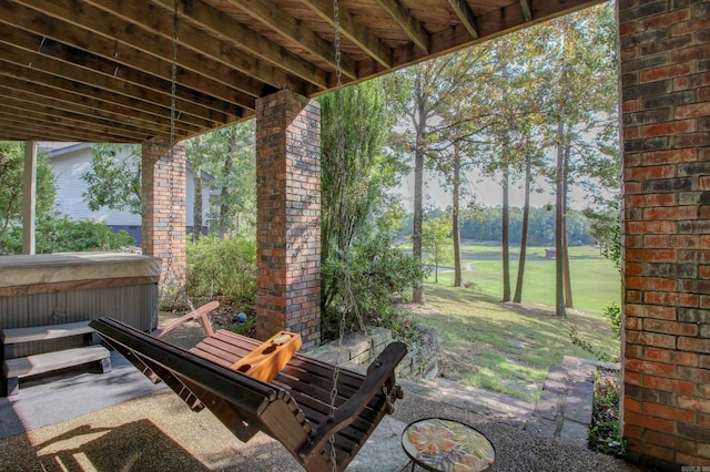 view of patio / terrace featuring a hot tub