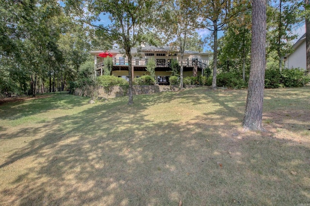 view of yard featuring a wooden deck